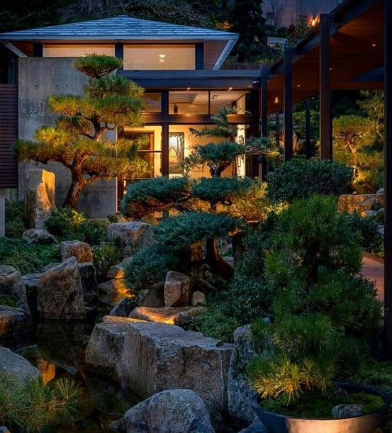 Narrow Chinese backyard with plenty of neatly trimmed trees and rocks