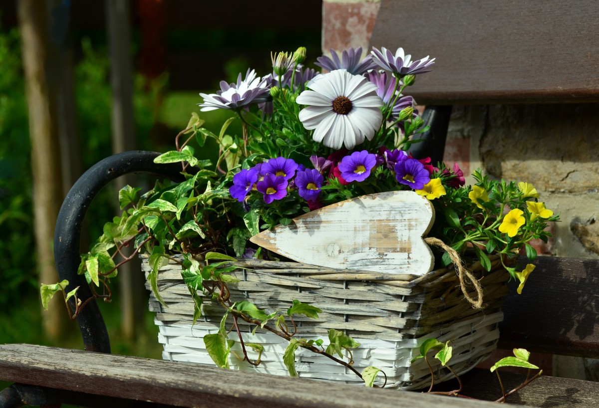 Various of flowers collected in one weathered rattan basket