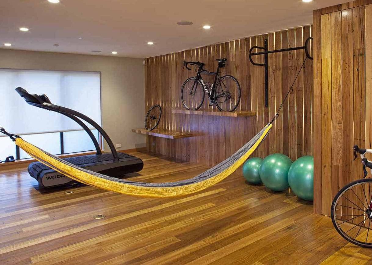 Wooden floor and accents to adding warmth to the overall garden gym interior