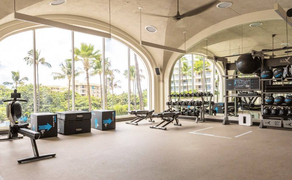 A luxury inspired fitness centre with large workout space and a beautiful view