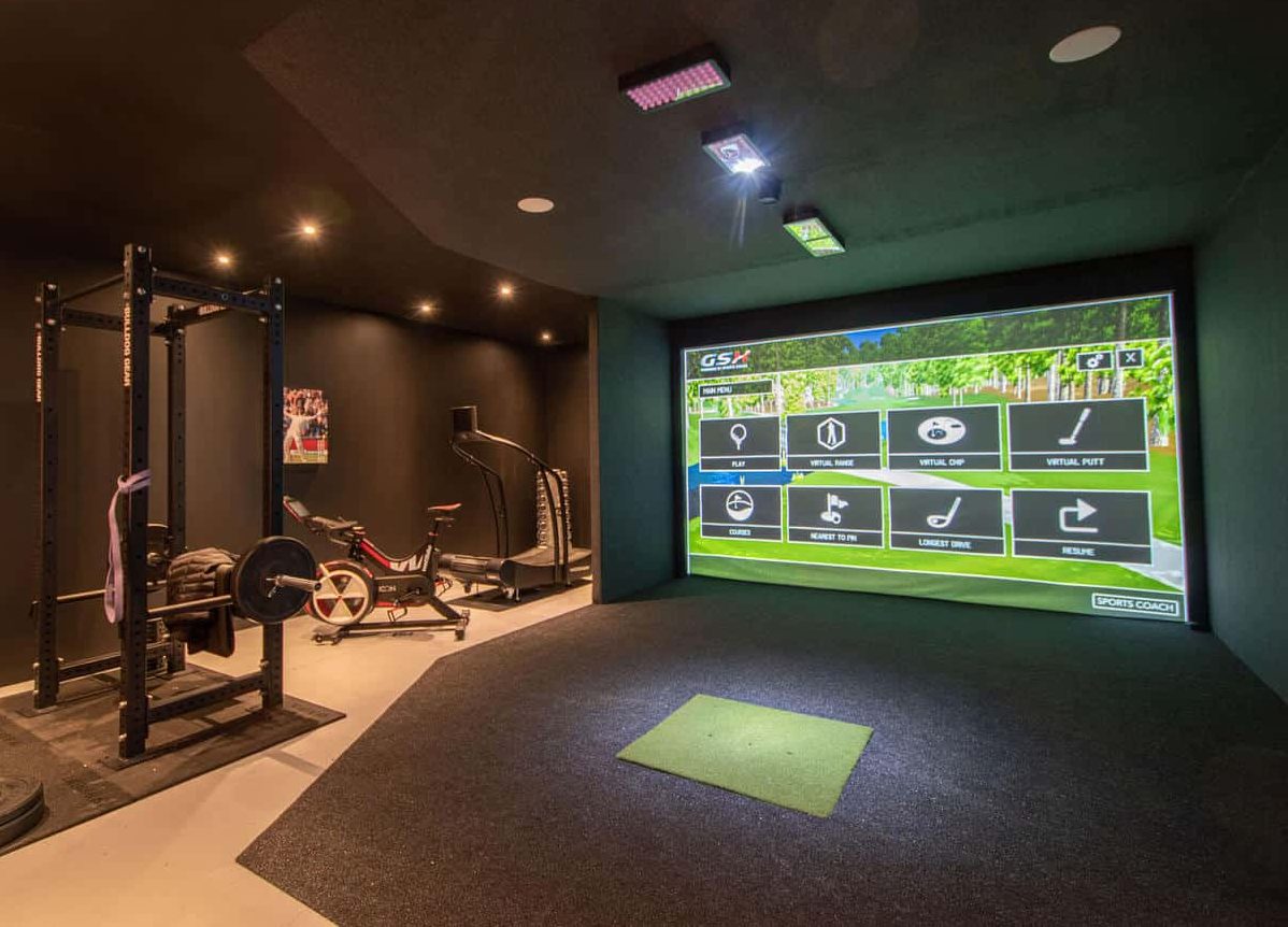 Modern gym room with a golf course simulator