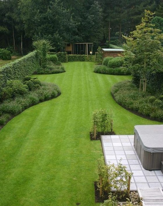 A simple, open garden filled with greens and trees