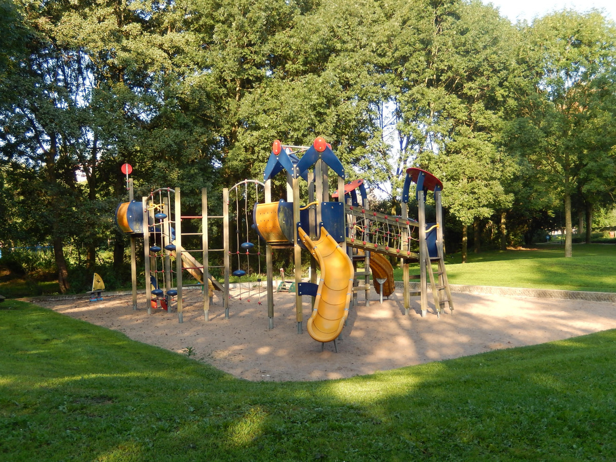 Children's playground with a huge yellow slide