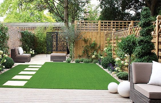 Artificial grass and stepping stones for a low-maintenance garden