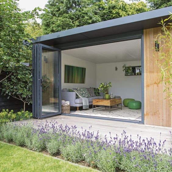 A mini log cabin as a garden living room