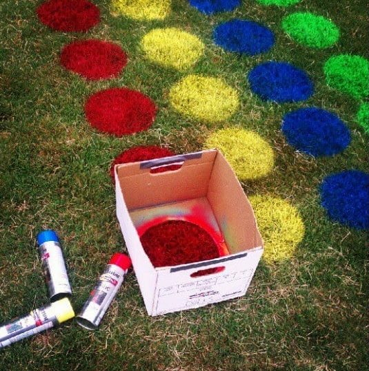 Garden twister game concept with painted lawns