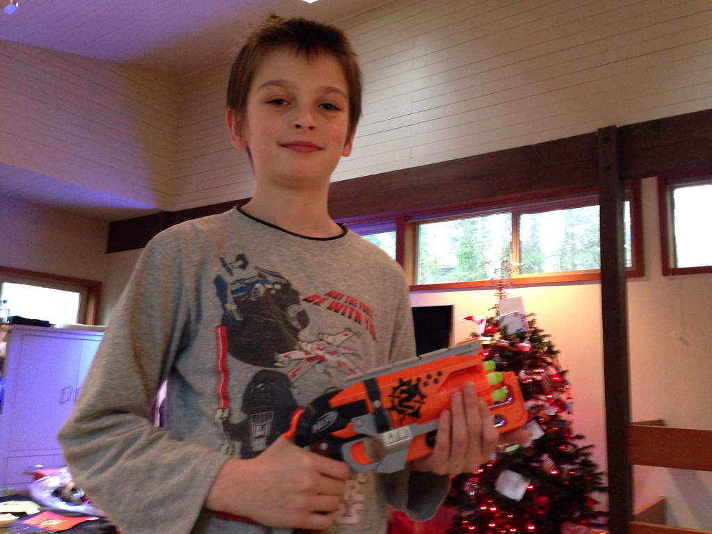 A kid holding a nerf gun