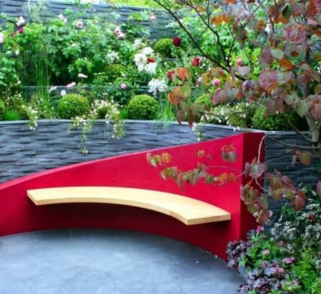 Creative singular garden bench in red and yellow colours