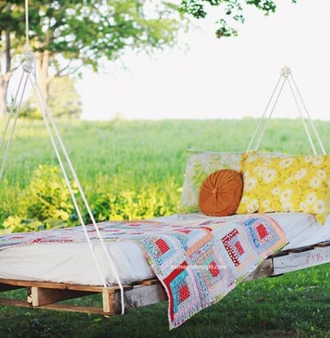 A garden hammock with DIY pallet frame