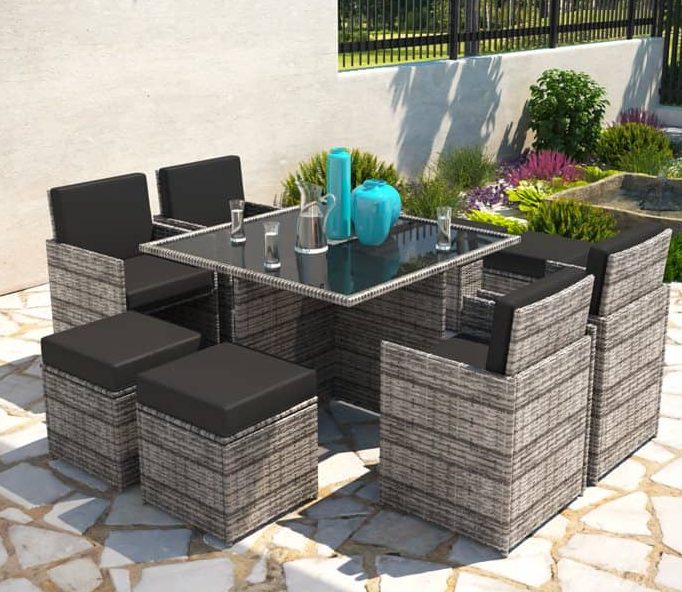 A rattan cube dining set on a small patio