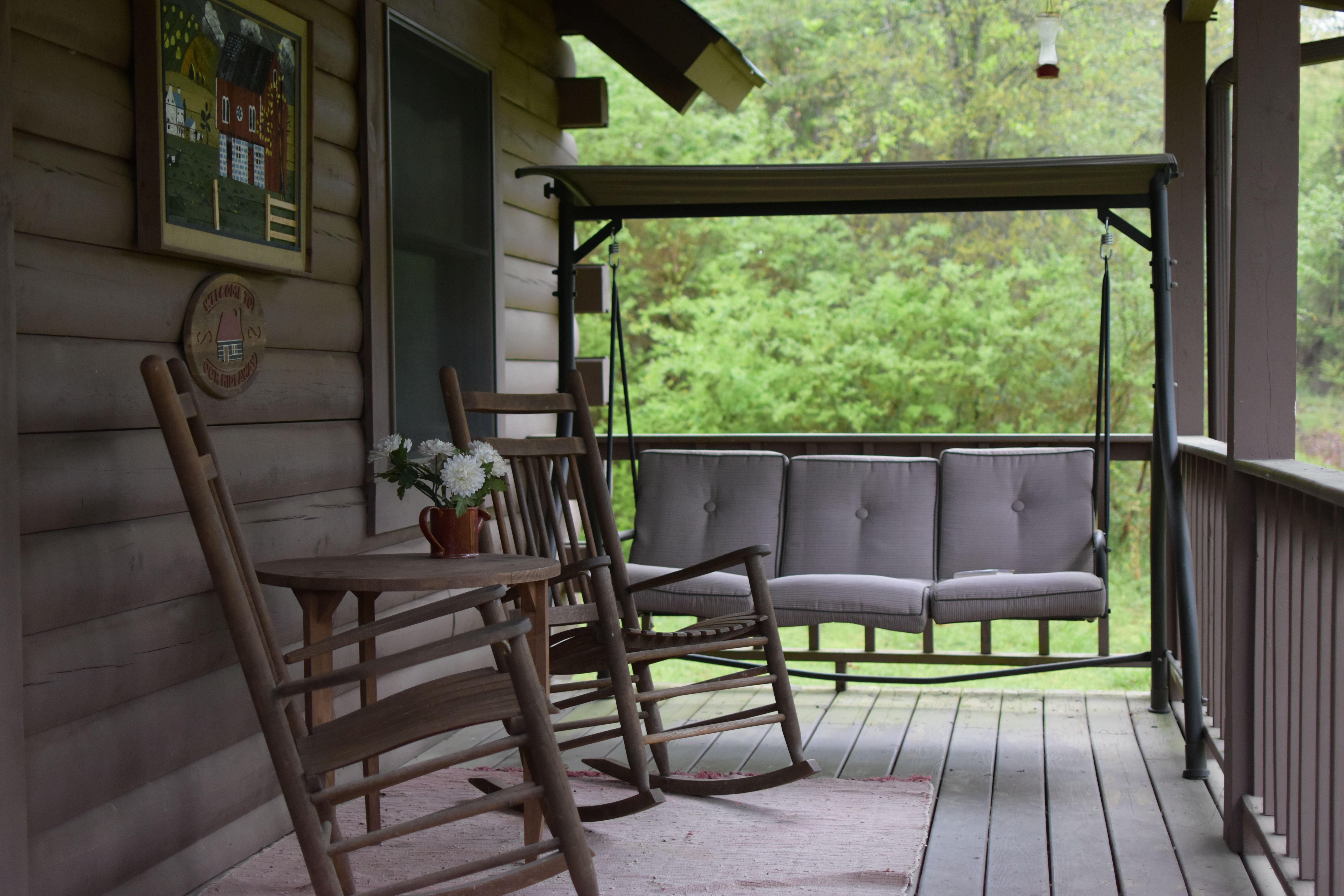 Brown wooden rocking chairs on porch