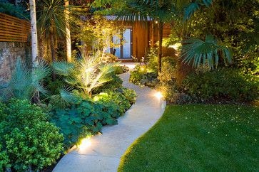 Path with lights and tropical plants