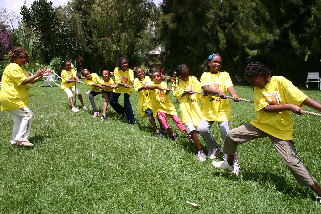 A team of girls playing tug of war