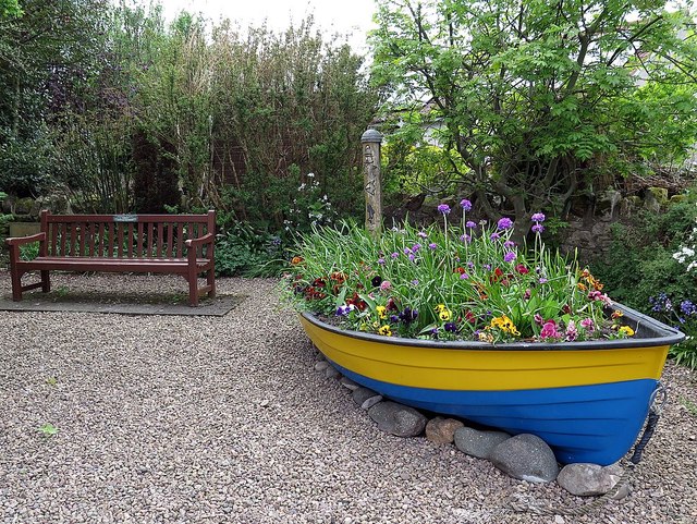 Old boat used as a garden planter