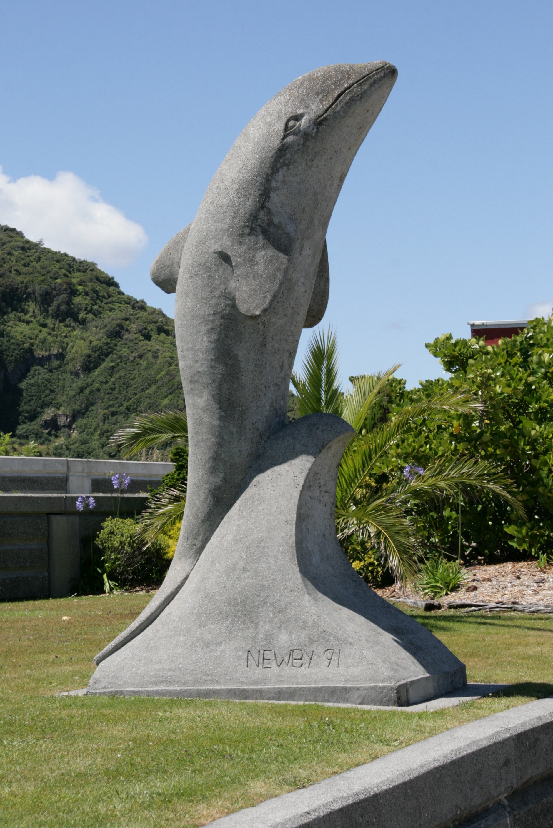 Dolphin stone statue