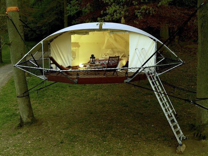 A floating treehouse, suspended between two trees
