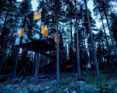 Mirrorcube treehouse with a sleek metallic design