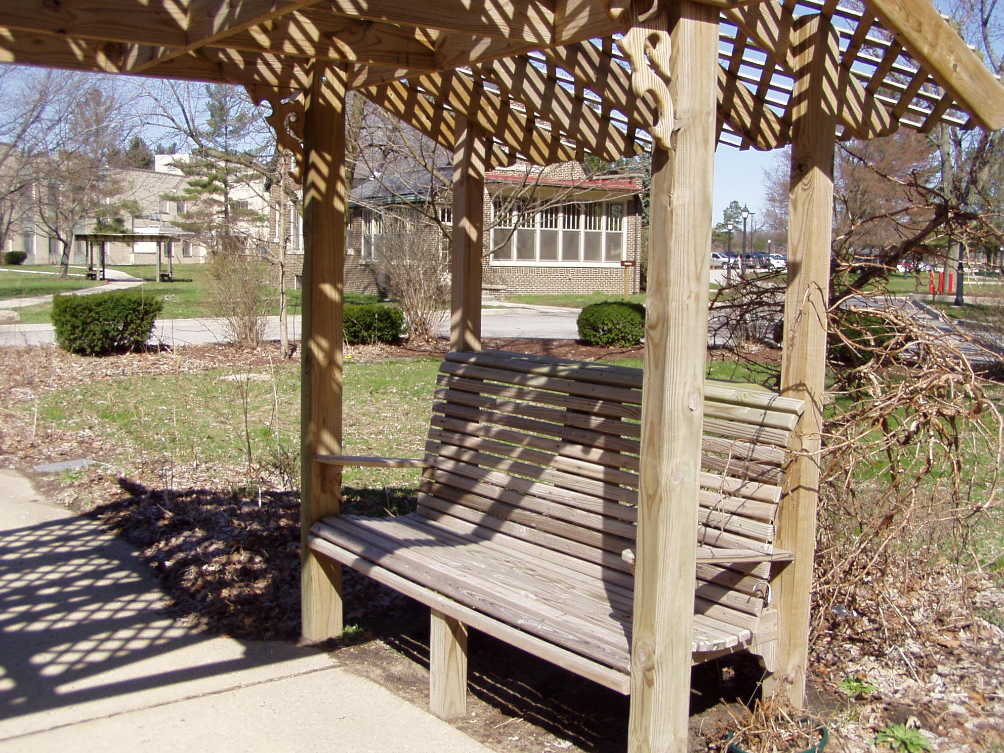 Wooden pergola with built-in bench