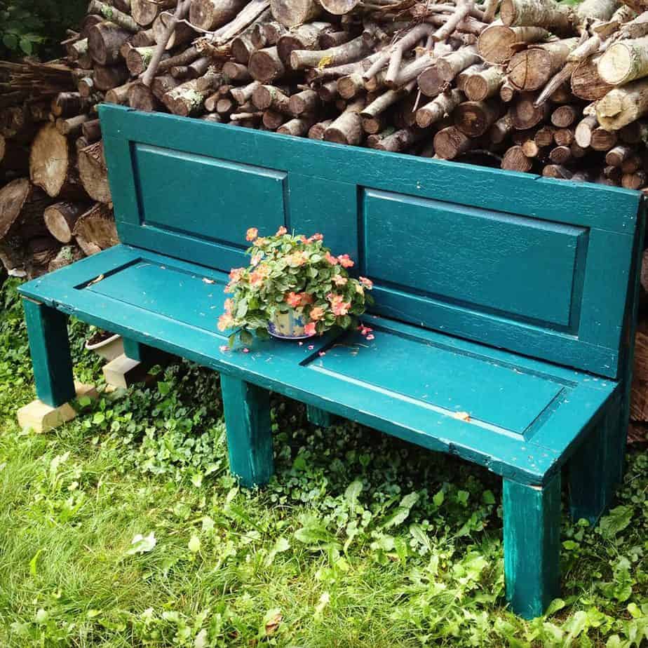 Blue garden bench made out of old doors