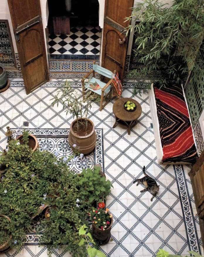 Courtyard is at the centre of a medina home, featuring zellige tiles