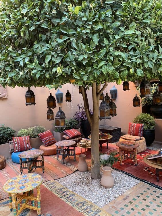 Moroccan style patio with floor cushions and low tables