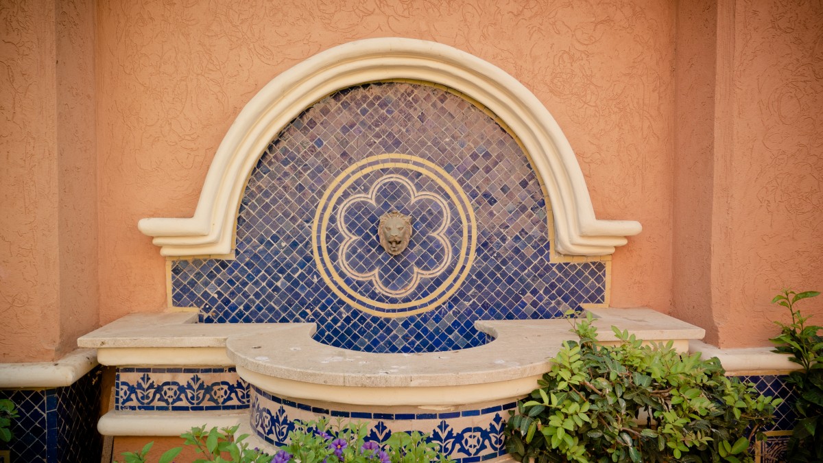 Moroccan wall tile fountain with a lion head at the centre