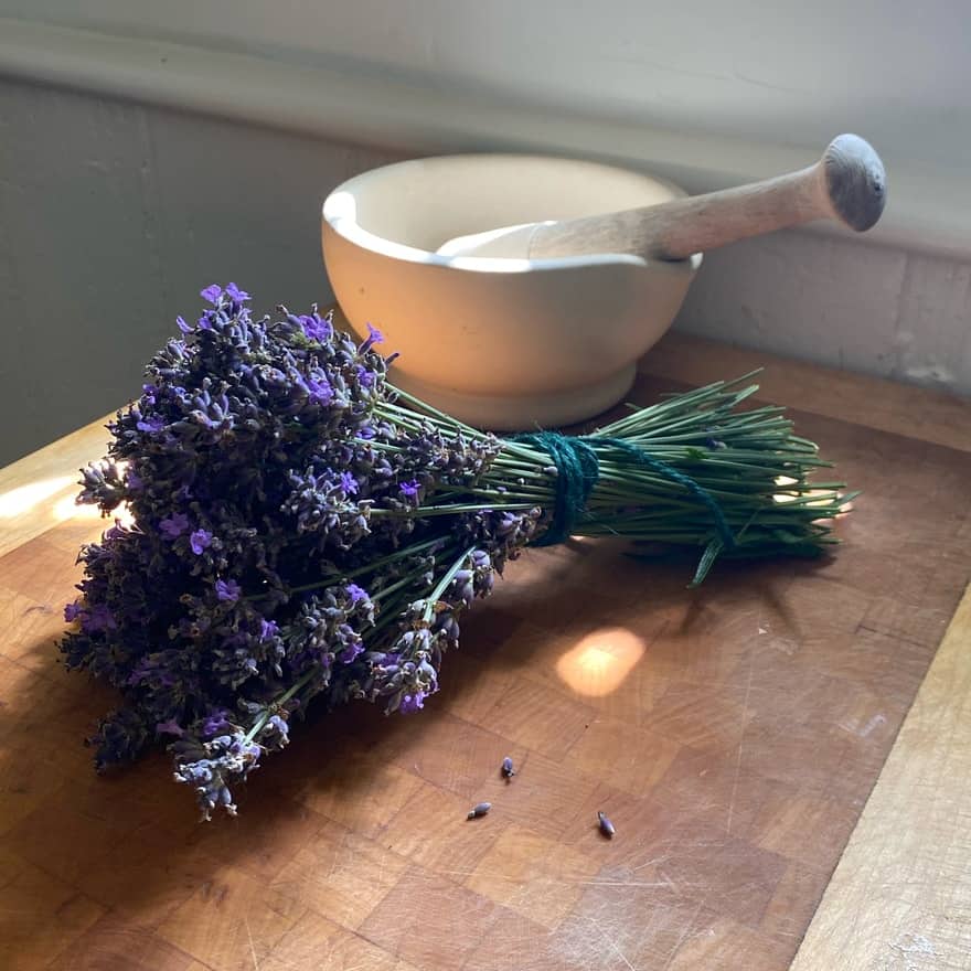 Small bouquet of lavender with porcelain mortar and pestle