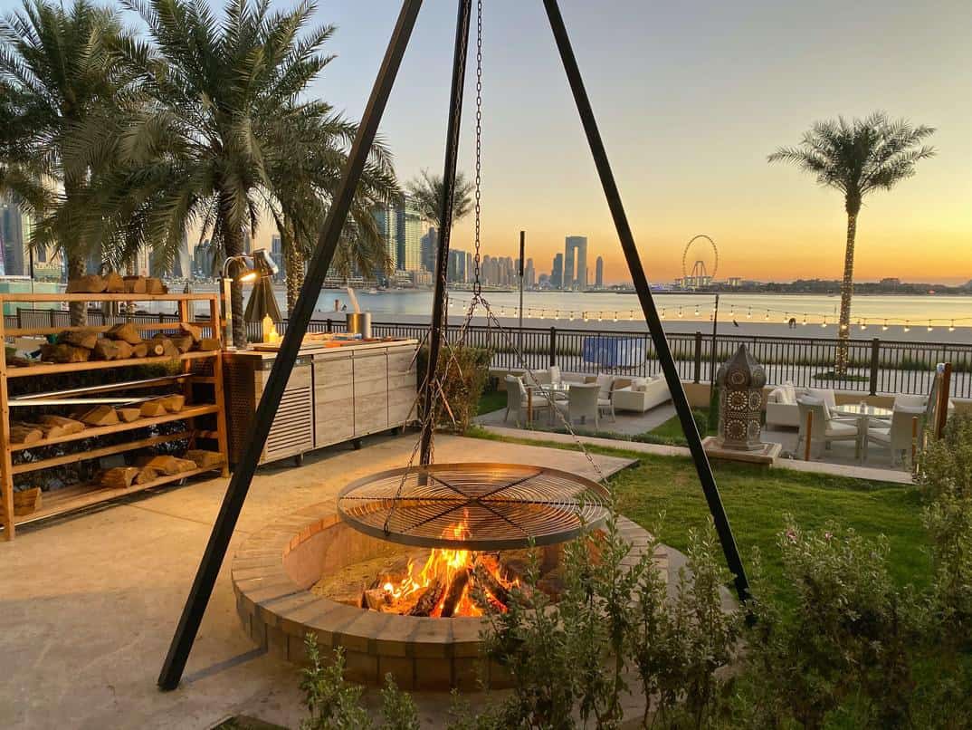 Fancy garden firepit with beautiful ocean background in Dubai