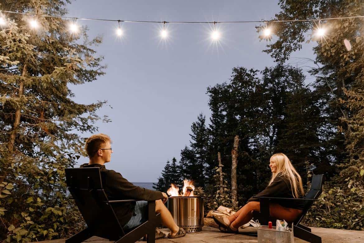 A couple cosying up around a DIY fire pit