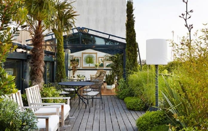 A rooftop garden designed like an actual living room