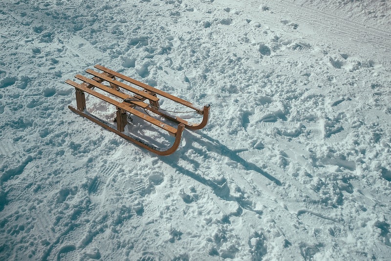 Wooden sled on snow