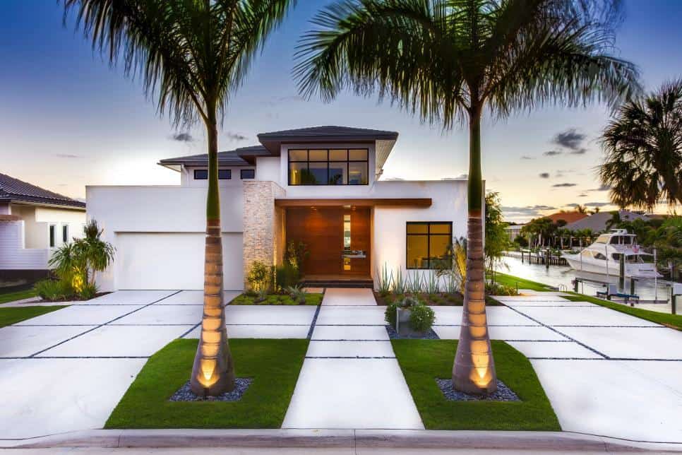 Coastal-themed front yard with palm trees