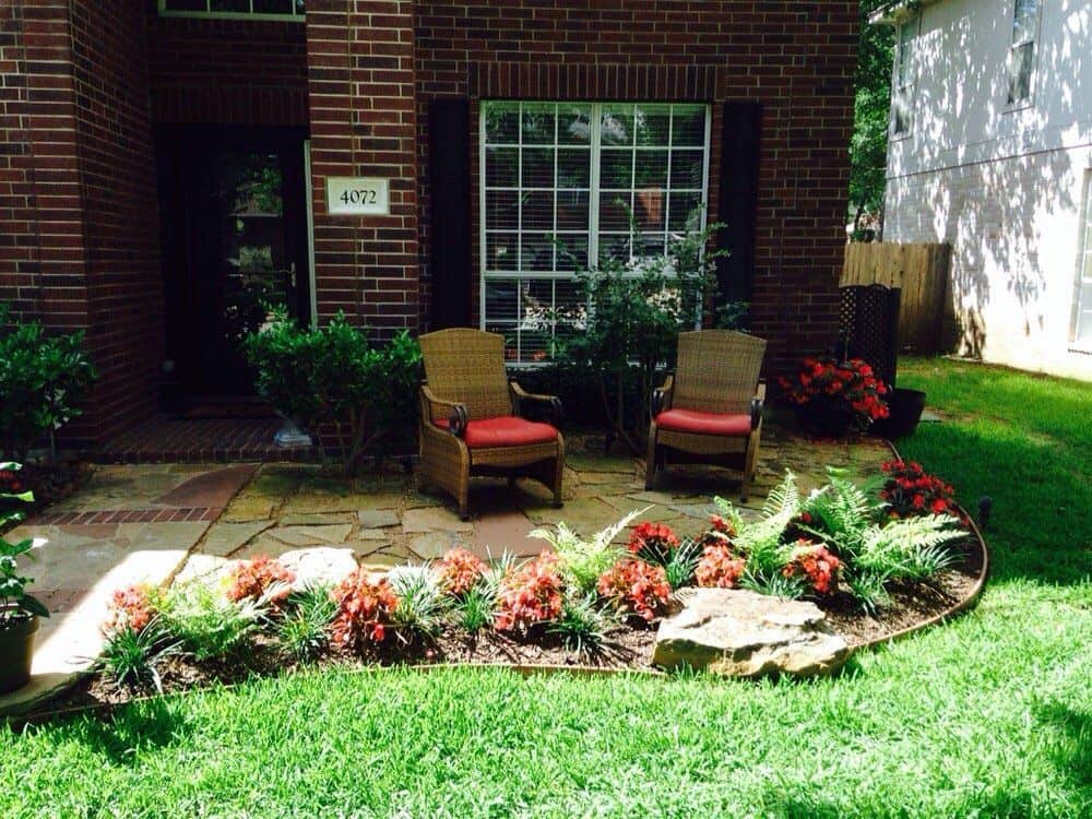 Front yard greenery with outdoor seating area
