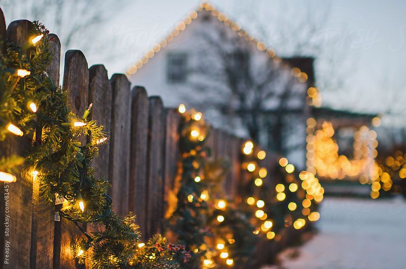 Fence with garlands and Christmas lights