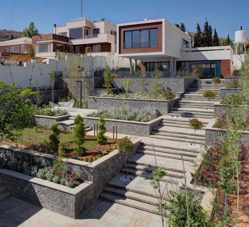 A modern-looking terraced sloped garden