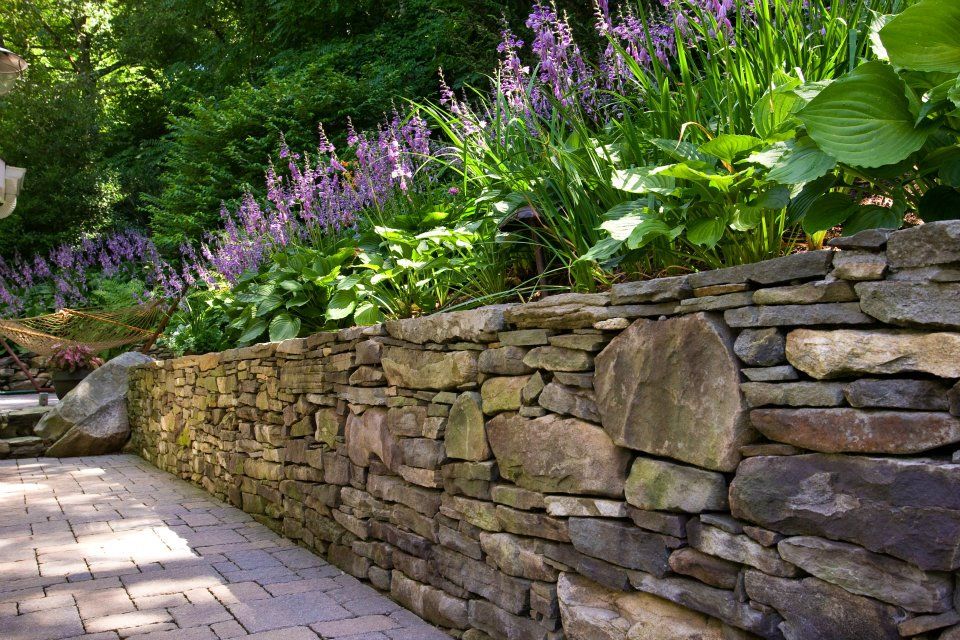 Stonewalls on a sloping garden for added interest