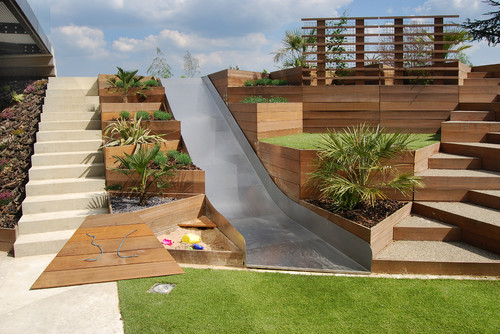 A sloping garden with a play area