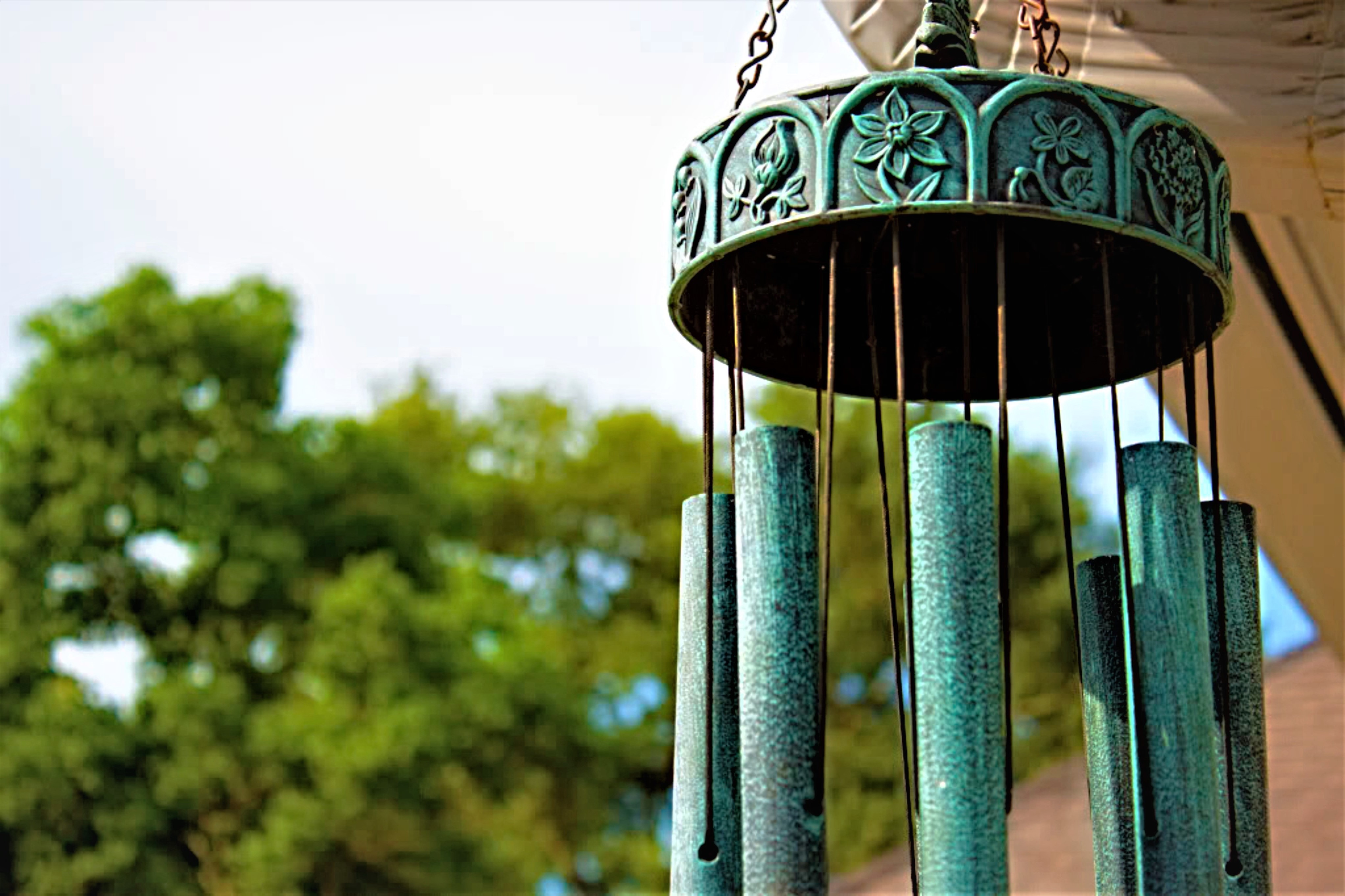 Wind chime with carved flwoers