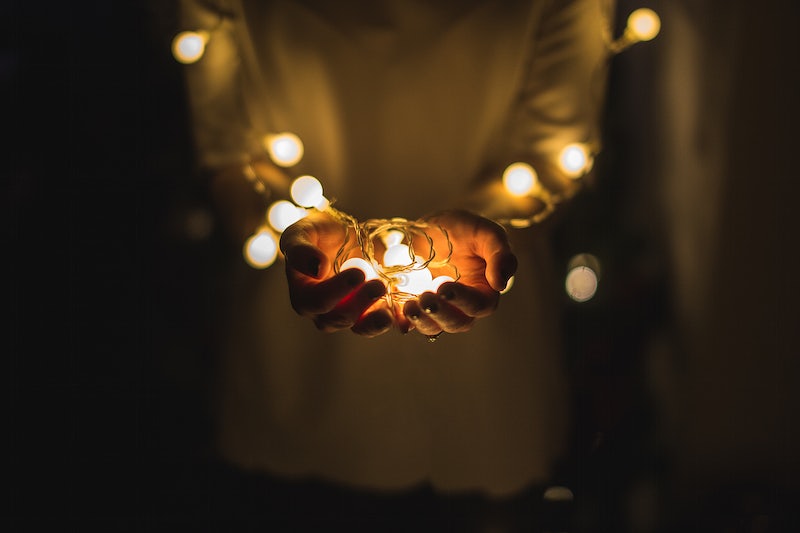 Person holding fairy lights