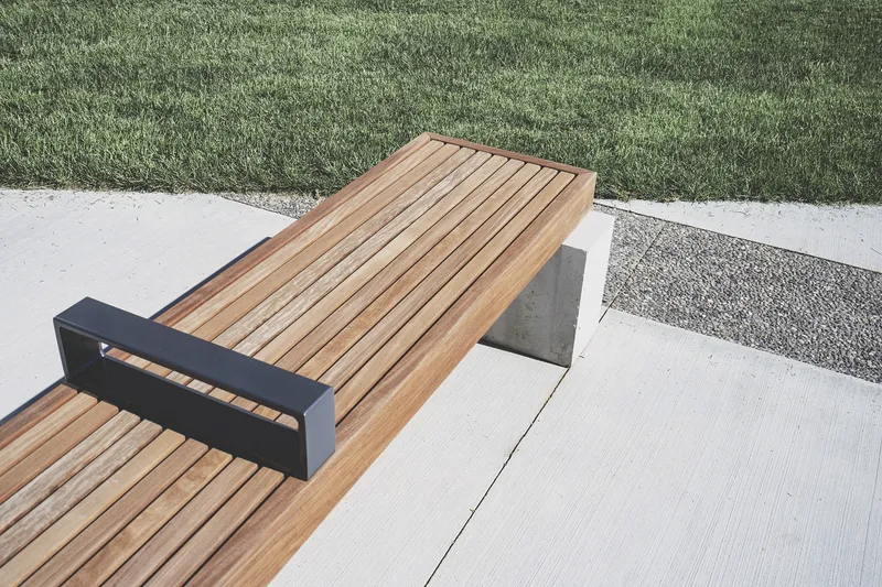 Built-in concrete bench with wooden seating surface