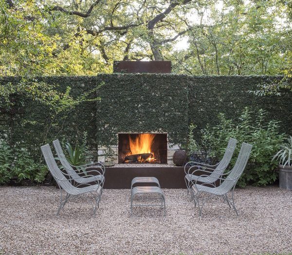 Minimalist patio setting with an outdoor fireplace