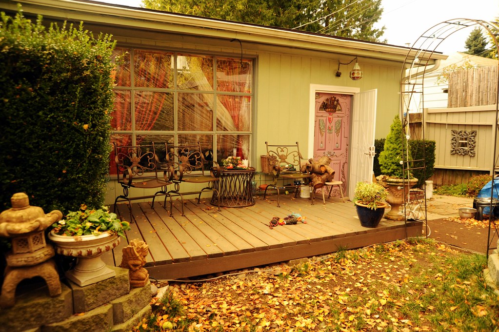 Raised wooden deck patio surrounded with fall leaves