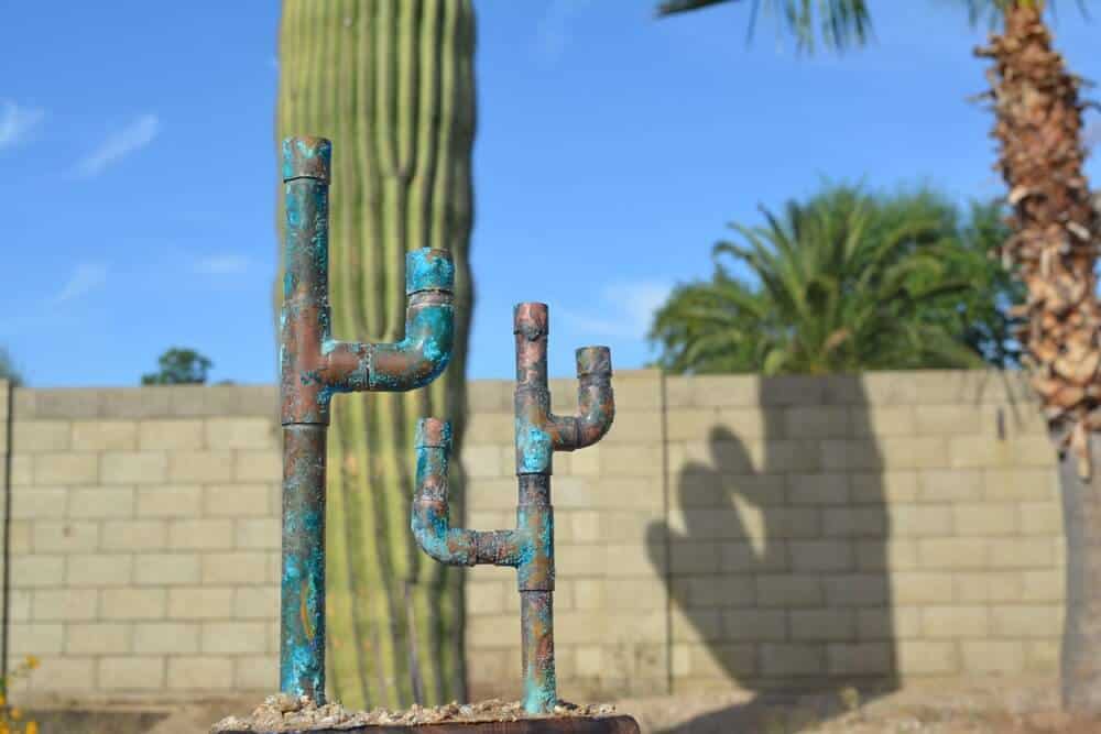 Metal pipe cacti sculpture