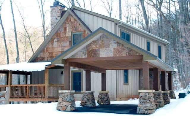 Drive-through style stone cabin carport