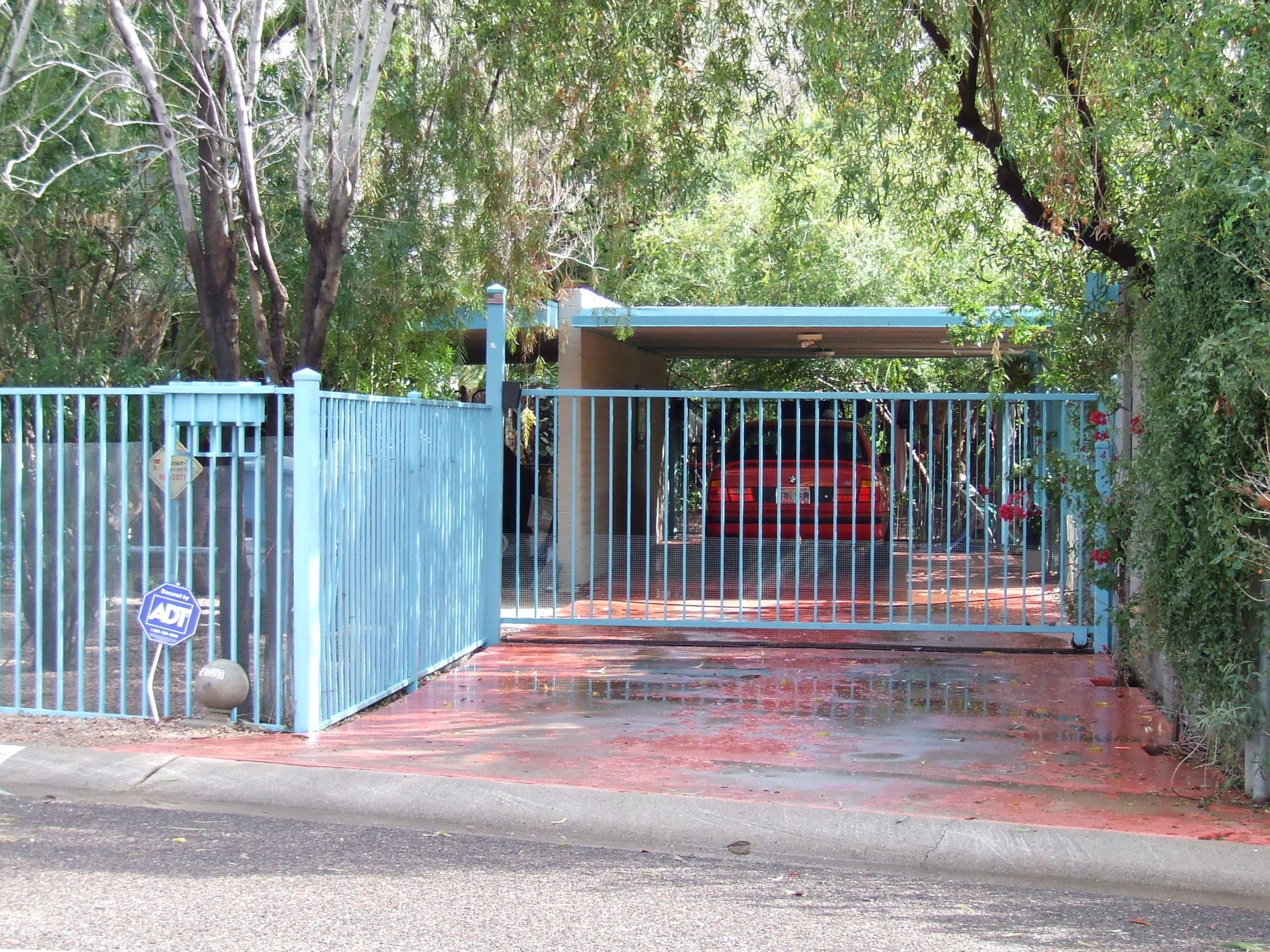 Blue single carport with matching gate