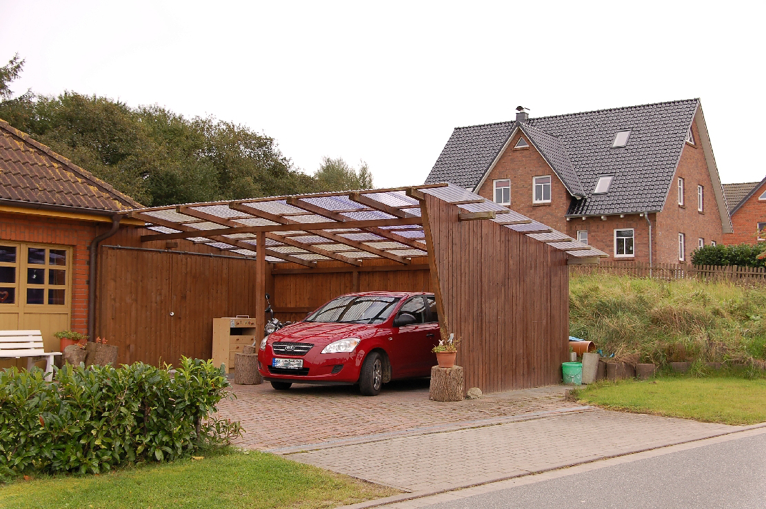 Modern rustic carport with a red car parked in