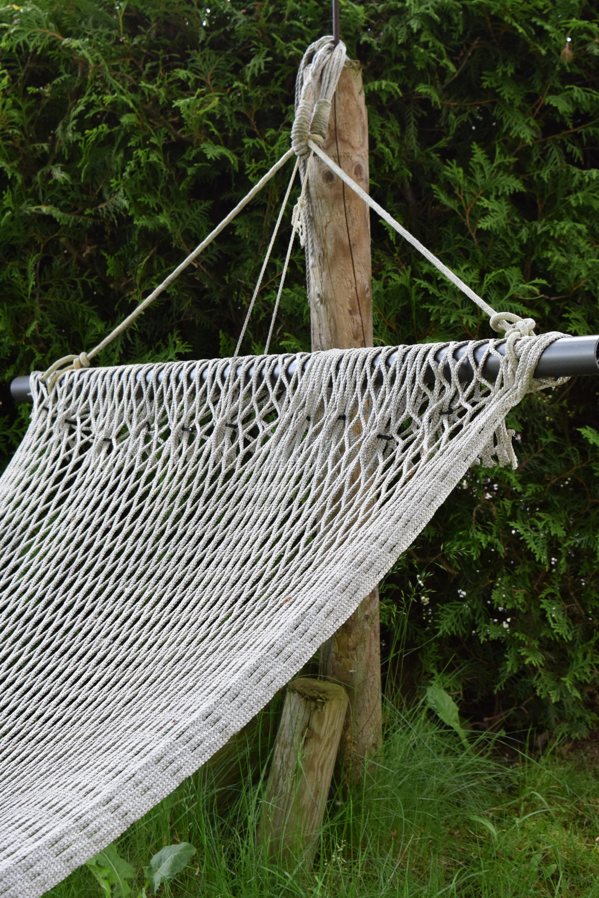 White hammock hung on a tree stick.