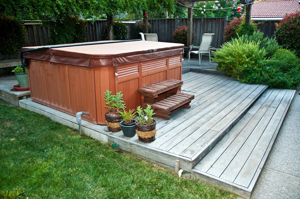 Decked patio with outdoor hot tub