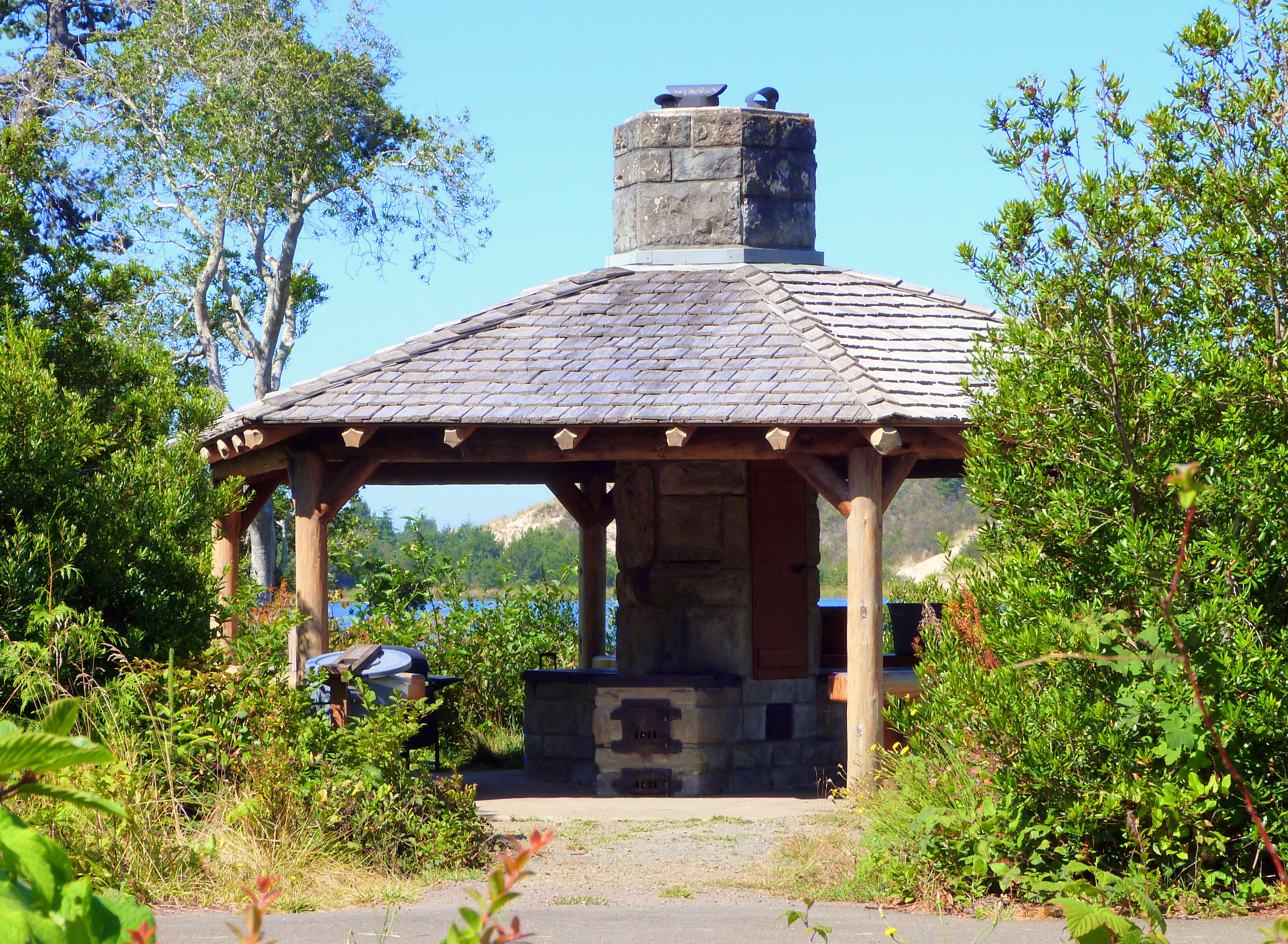Outdoor kitchen gazebo with a chimney