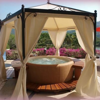 Inflatable hot tub with a pergola tent